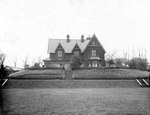 20th April 1937 Number 1 Spen Lane. Building known as 'Crooked Acres' which was, and still is owned by Leeds Community and Mental Health Trust. View shows grounds with grass, shrubbery and trees on banking with steps leading up to house 